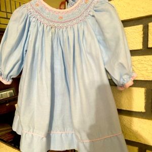 Classic whimsy baby blue long sleeve smocked dress with bloomers! Worn once!